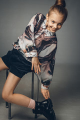 Child-girl with long hair gathered in a bun