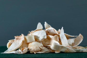 Several peeled mushroom skins