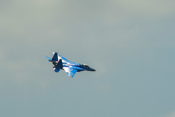 Fighter jet flying on display near Changi Air Base