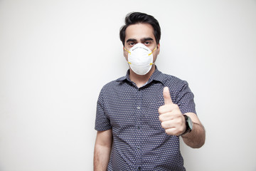 Middle Eastern man wearing a protective mask at work for corona virus treatment