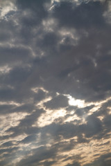 The sky is covered with small clouds. The sun shines through the clouds. Background.