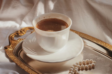 Morning coffee. morning. Black coffee in white mug. Sun rays. Sunny morning