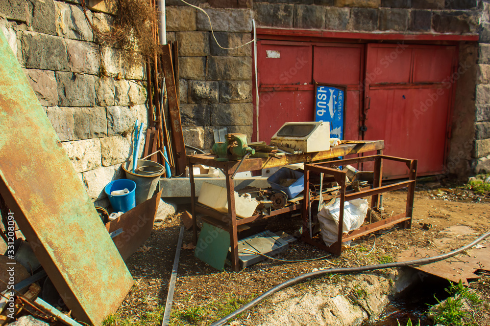 Wall mural the old rusty iron table and chairs in outdoor