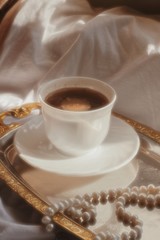 cup of coffee and cookies on wooden table
