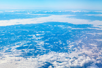clouds above snowy mountains scenery