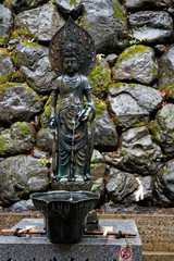Japan water spring from steel statue of god woman - 331208479