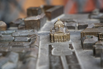 Lviv city in steel miniature. Old monument castle and church miniature