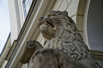 Close-up Lion statue sits majesticaly on it's pedestal.