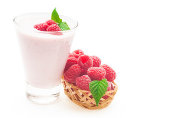 Yogurt with ripe red raspberry isolated on white background