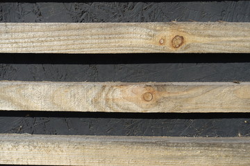 Close view of horizontal unpolished and unpainted wooden planks