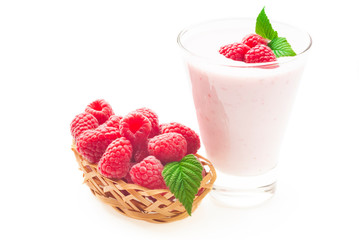 Yogurt with ripe red raspberry isolated on white background
