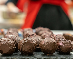 chocolate truffle on black plate