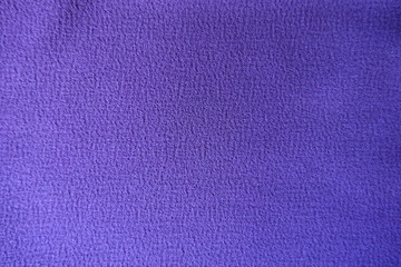 Thick purple polyester fabric directly from above