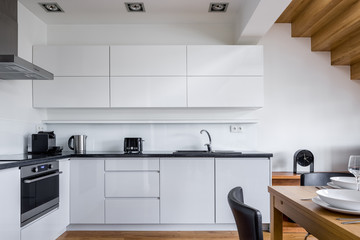 Elegant kitchen with white furniture
