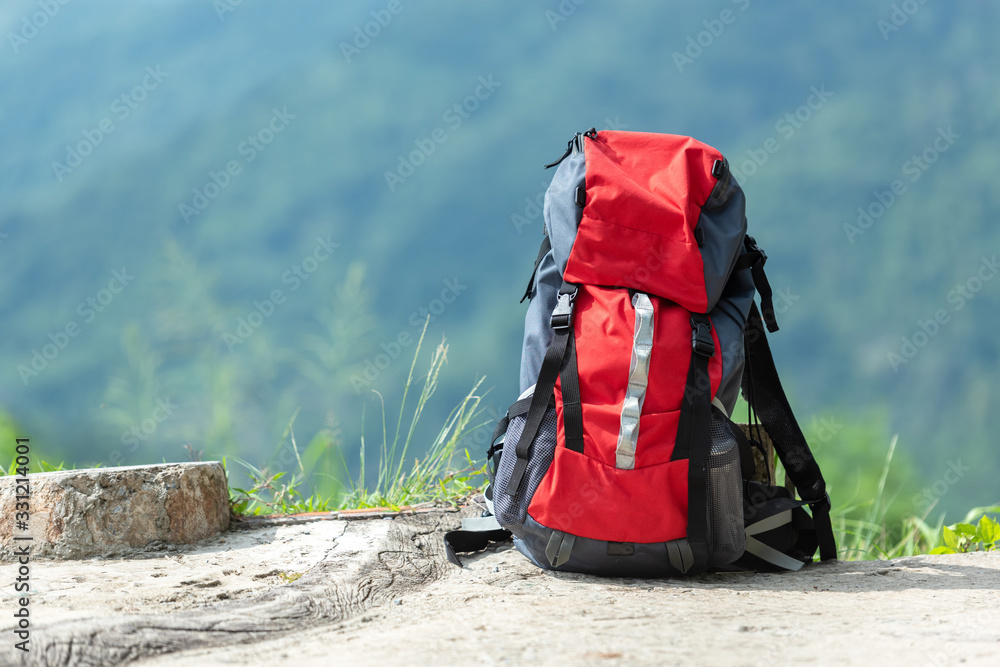 Wall mural hiking backpack travel gear on mountain. items include hiking for travel destination and leisure in 