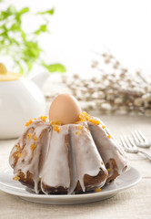 Easter cake with icing and egg on top