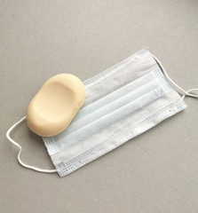 Fototapeta premium Medical disposable masks and soap to protect against the virus.Prevention of coronavirus.Remedies.Hygiene products.