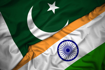 Pakistan India flags. Diplomacy, borders and territorial concept. Image shows two shiny silk flags,...