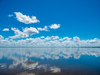 White cloud reflections in Sarasota Bay from Longboat Key in southwestern Florida