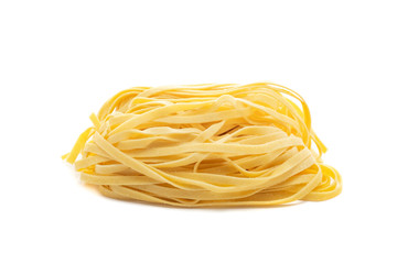 Fresh uncooked tagliolini pasta isolated on a white background