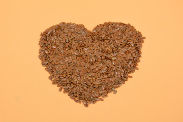 Linum usitatissimum is scientific name of Brown Flax seed. Also known as Linseed, Flaxseed and Common Flax. Pile of grains