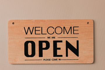 A sign hanging off Coffee shop door,Close sign blur background,Label word close