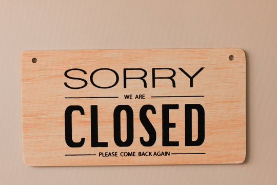 A Sign Hanging Off Coffee Shop Door,Close Sign Blur Background,Label Word Close