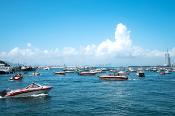 Obraz premium Tourists travel by sea on speedboat in Qingdao, China