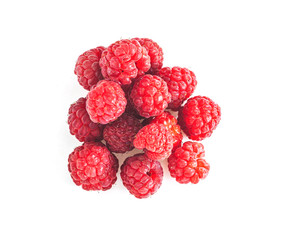 Heap of Ripe raspberries with green leaf isolated