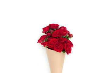 Red rose bouquet wrapped vintage craft paper.