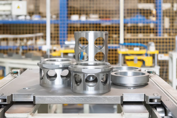 The steel cylindrical parts are on the machine platform