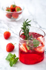 Summer strawberry drink on marble white background.