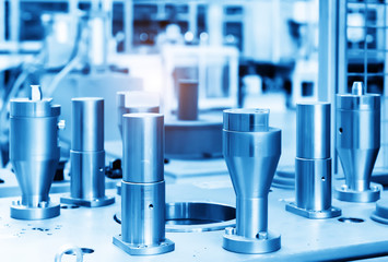 The steel cylindrical parts are on the machine platform