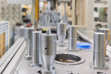 The steel cylindrical parts are on the machine platform