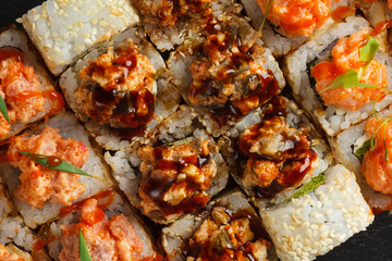 Japanese food: Set of salmon sushi and rolls with salmon and eel