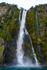 Fototapeta na wymiar A waterfall at Milford Sound, Fiordland National Park, New Zealand