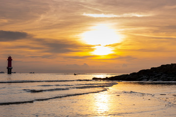 Early morning sunset / sunrise with Vew of volcano Agung mountains of Bali and sea and beach, Bali, Indonesia. Azure beach, rocky mountains in ocean in morning background