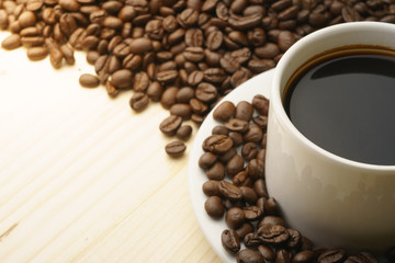 Fototapeta premium close up on coffee cup with coffee beans. free copy space for your text