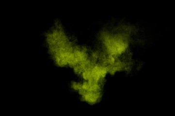 Light green powder explosion on black background. Colored powder cloud. Colorful dust explode. Paint  Holi.