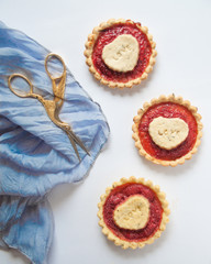 Fruity pie full of strawberry. White background