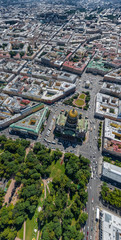 Aerial view of center of St.Petersburg, golden dome of Isaac Cathedral, Palace square in a sunny weather, the museum Hermitage, the river Neva, Peter and Paul Fortress, streets and roofs