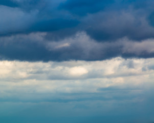 Fantastic clouds against blue sky, panorama