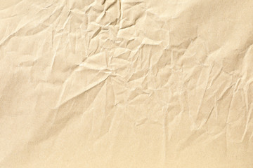 Old pale yellow crumpled paper background texture