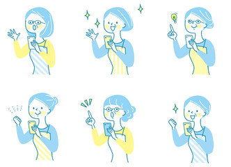 スマホ　驚く　シニア女性　エプロン　