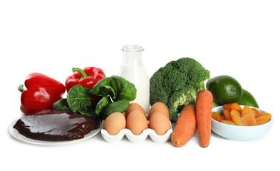 Fresh products rich in vitamin A on white background