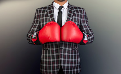 Businessman with boxing gloves and suit ready for challenges conceptual banner