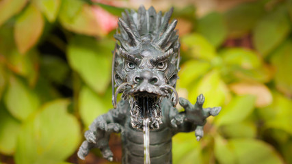 A dragon fountain at the entrace of shinto shrine