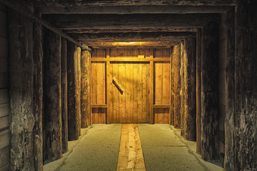 Wooden corridor with door in the salt mining caves