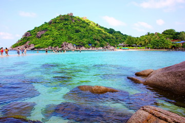 big and small shape brown rock on beach with sea landscape nature background,copyspace.