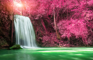 Beautiful waterfall with sunlight in autumn forest at Erawan National Park, Thailand, Nature landscape 